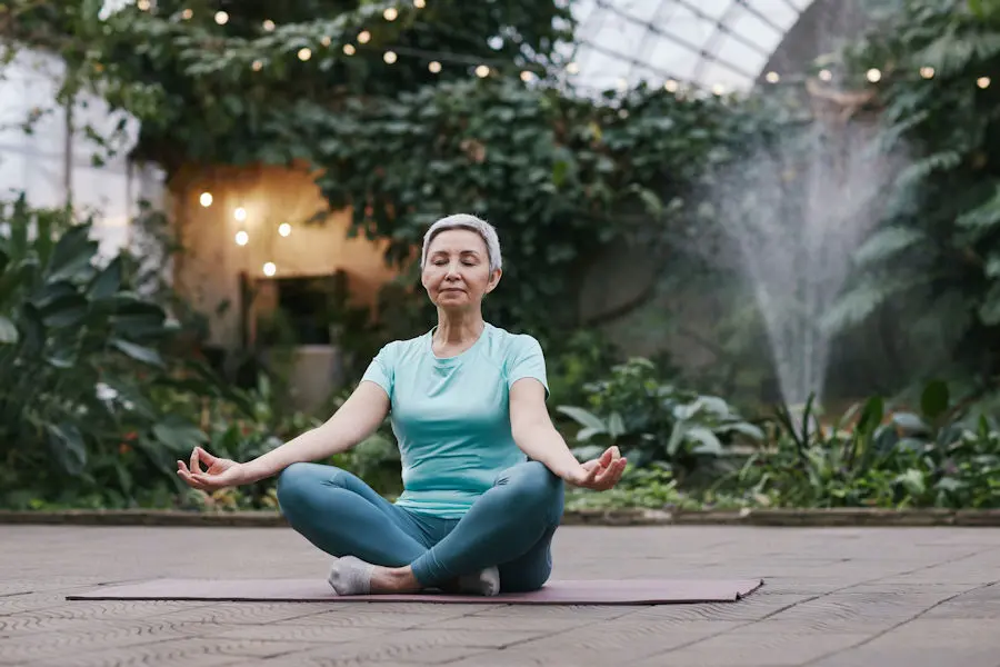 Older lady sat in yoga pose