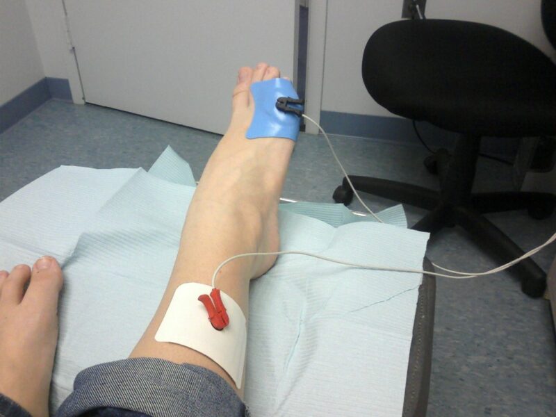 A physical therapist working with a patient